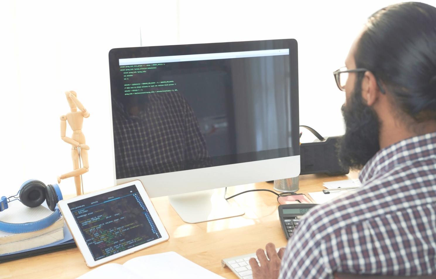 Mobile app testing environment showing debugging tools and testing devices used for comprehensive app analysis